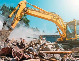 Excavator demolishing