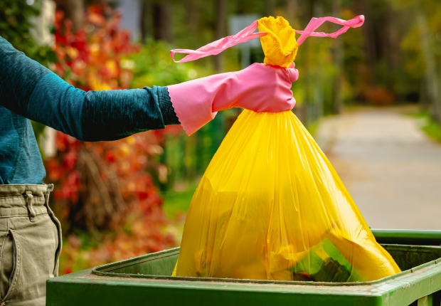 Person throwing away trash